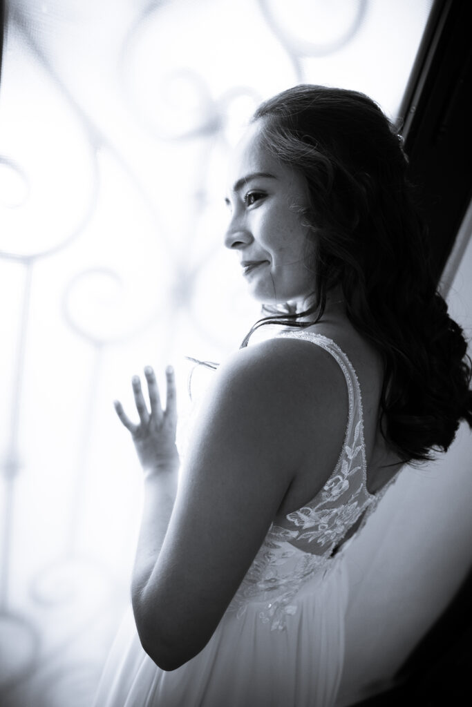 bride in front of our beautiful wrought iron door at rose haven austin texas wedding venue, dripping springs wedding venue, georgetown wedding venue, san antonio wedding venue, texas hill country