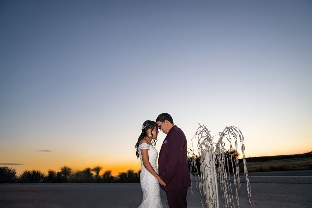 filipino couple at sunset in front of rose haven event venue, austin texas, austin wedding venue, dripping springs wedding venue, san antonio wedding venue, austin bride, cheap rehearsal dinner venue. austin wedding vendor, local event vendor, best austin wedding vendors, 