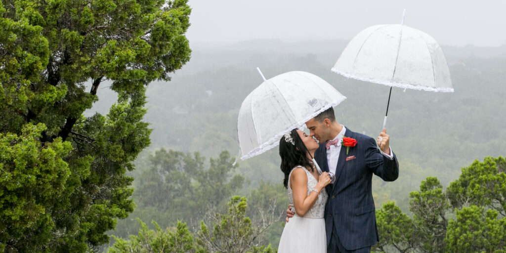 Couple kissing in the rain at Chapel Dulcinea Austin Wedding Chapel, Free Wedding Chapel, Texas Hill Country Wedding Chapel, Austin Wedding Venue, Austin Bride, Austin wedding reception, Hill Country chapel, Hill Country wedding venue, Dripping Springs Wedding Venue